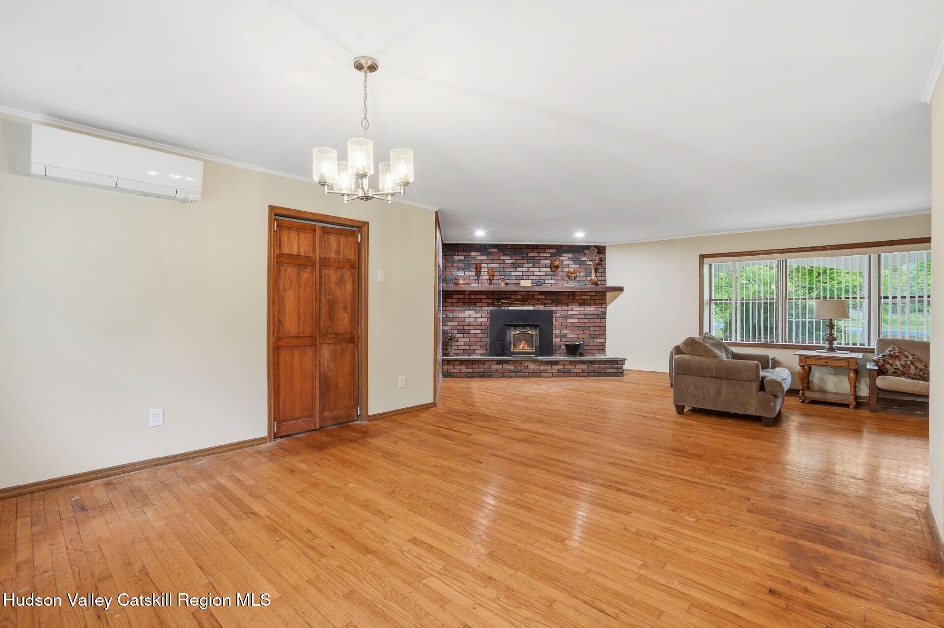 984 Blue Mountain Road Saugerties, NY 12477 - Photo 10 of 24 a view of livingroom with furniture wooden floor and window