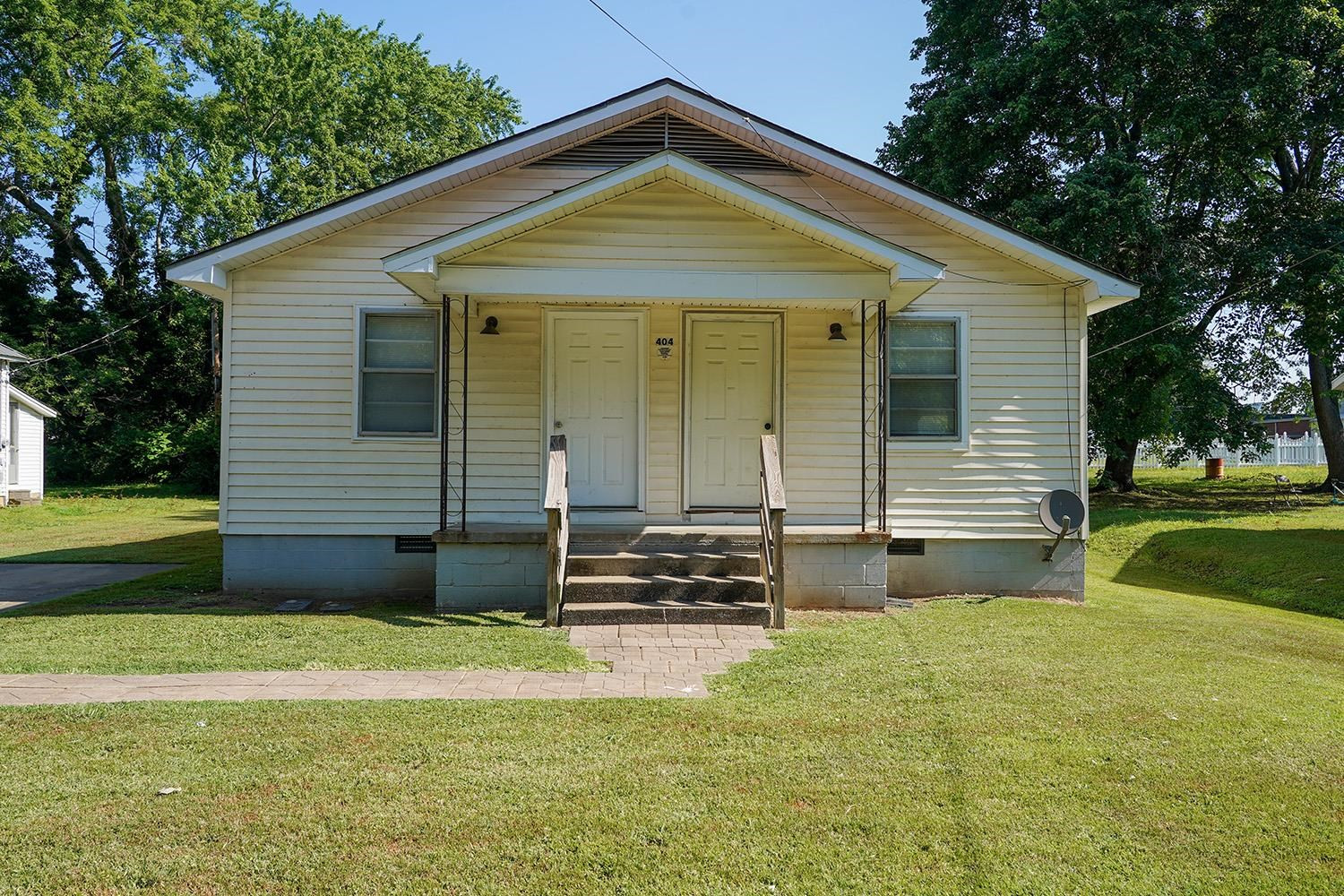 404 West Mill Street Rutherford, TN 38369 - Photo 1 of 12 a front view of a house with garden