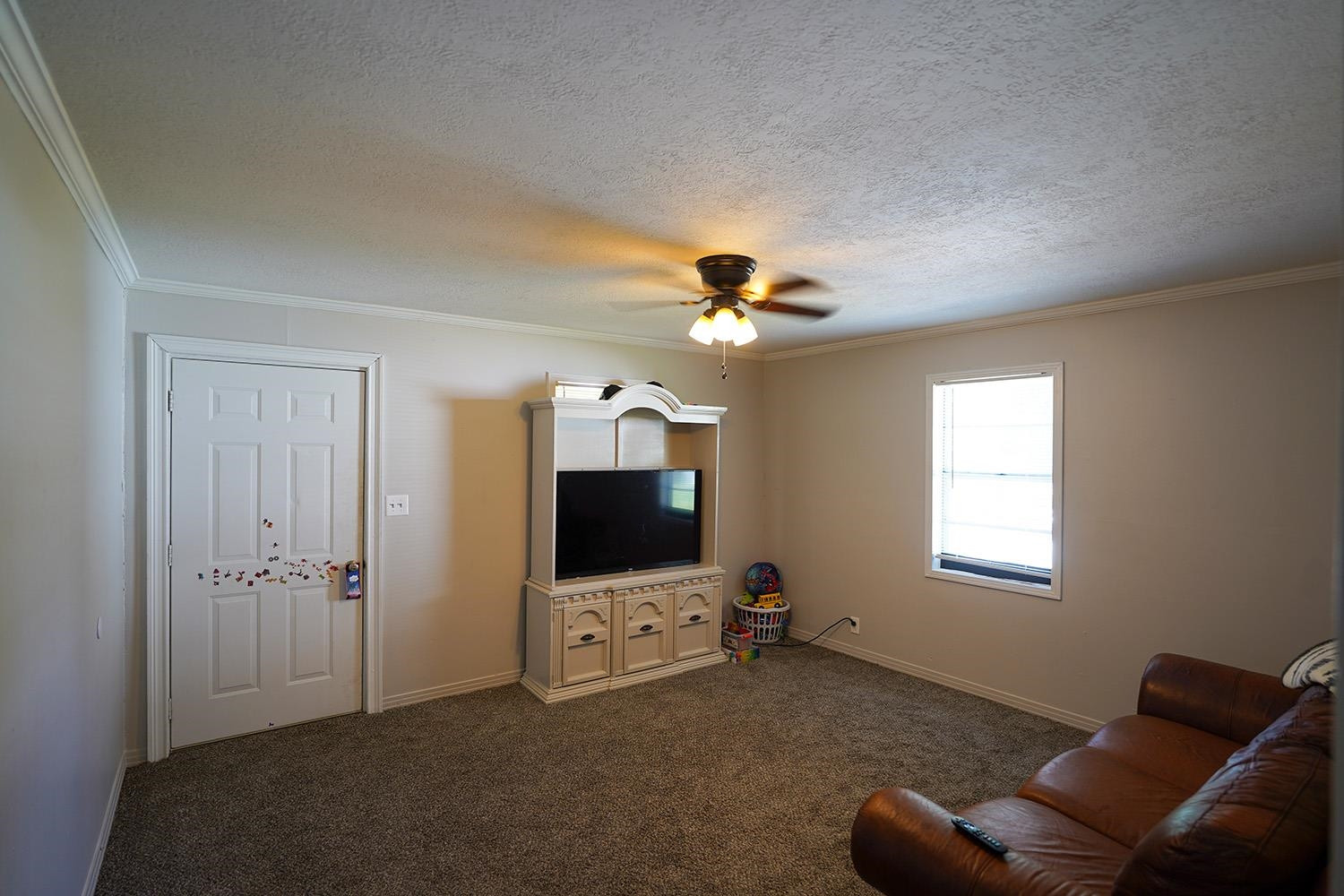 404 West Mill Street Rutherford, TN 38369 - Photo 2 of 12 a living room with furniture and a flat screen tv