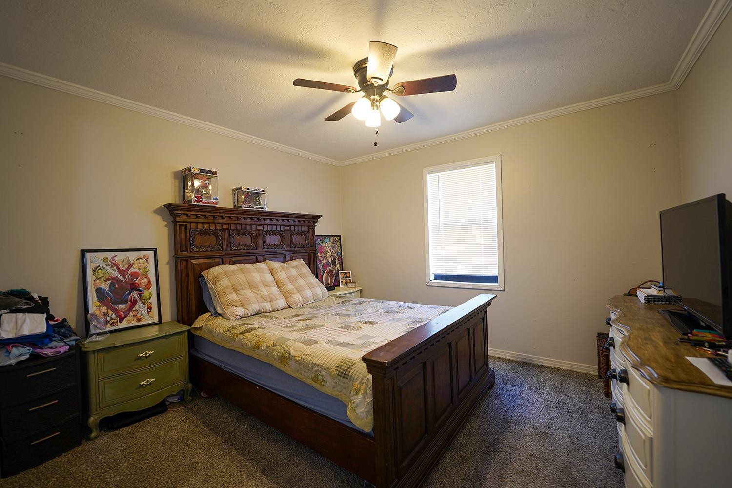 404 West Mill Street Rutherford, TN 38369 - Photo 7 of 12 a bedroom with a bed and a chandelier