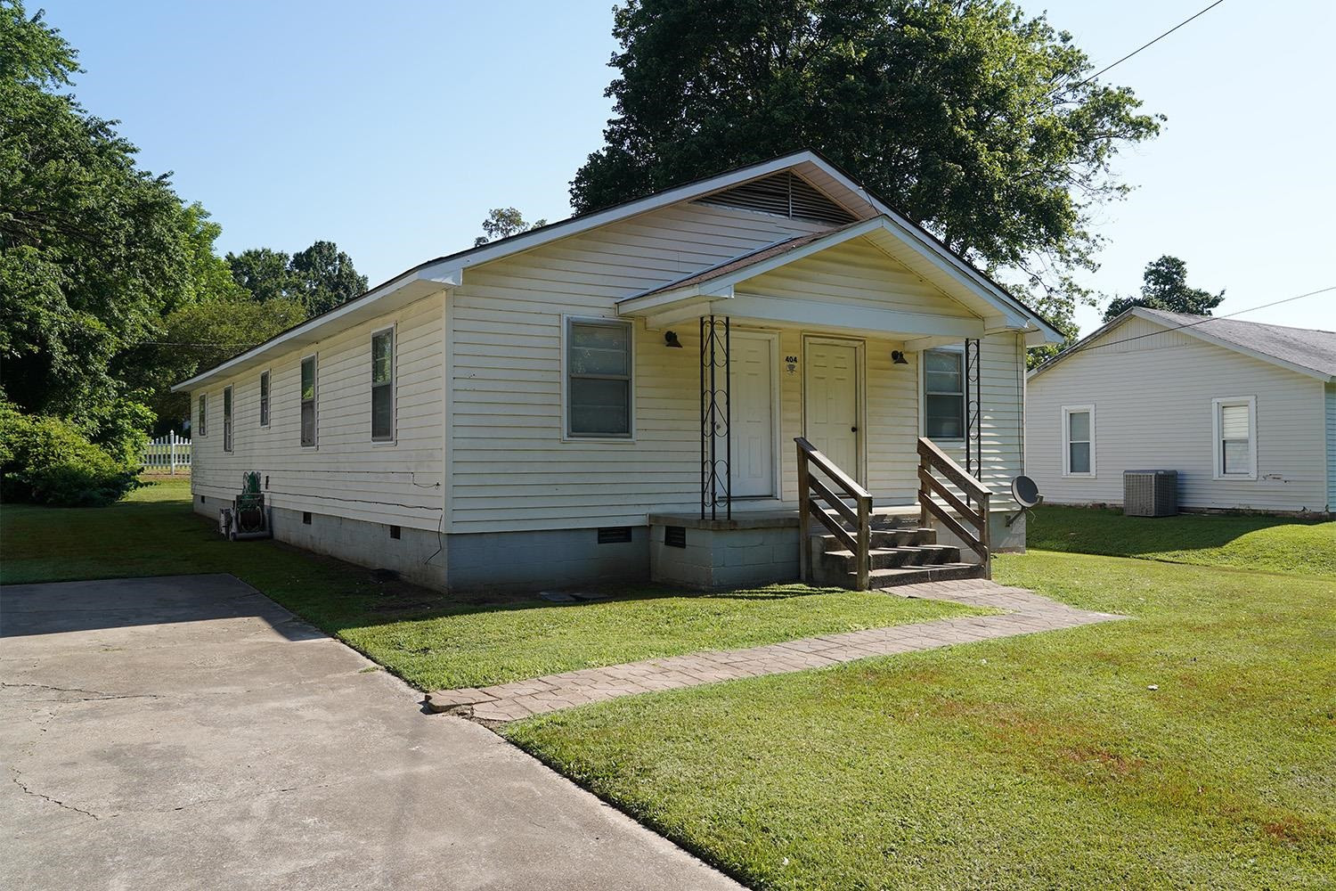404 West Mill Street Rutherford, TN 38369 - Photo 10 of 12 a front view of a house with yard and green space