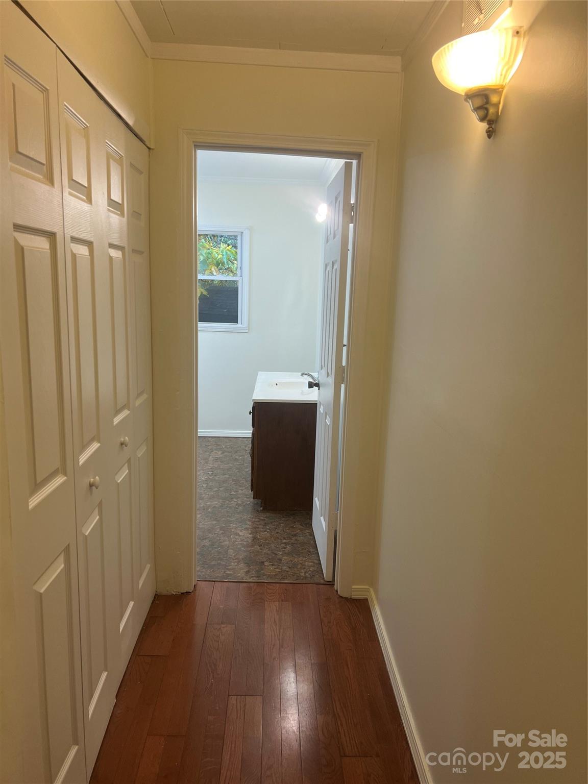 243 Governors View Road Asheville, NC 28805 - Photo 11 of 17 a view of a hallway with wooden floor and closet