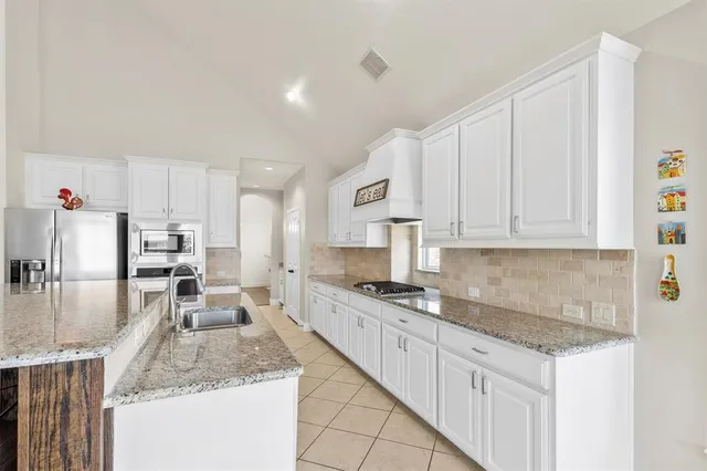 a view of room with table and chairs