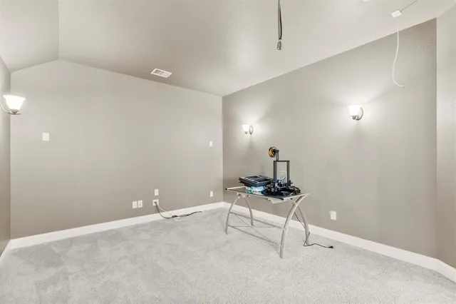 a bed room with a bed and a ceiling fan