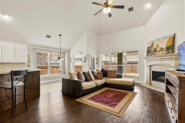 a kitchen with stainless steel appliances granite countertop a sink and a refrigerator