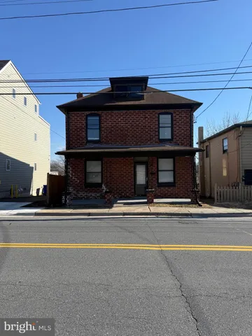 a view of a house with a large window