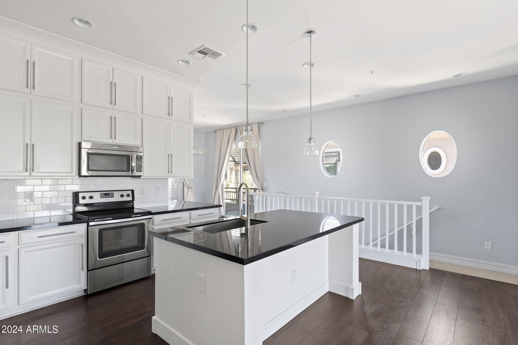 6565 East Thomas Road, Unit 1109 Scottsdale, AZ 85251 - Photo 12 of 40 a kitchen that has a sink a window and stainless steel appliances