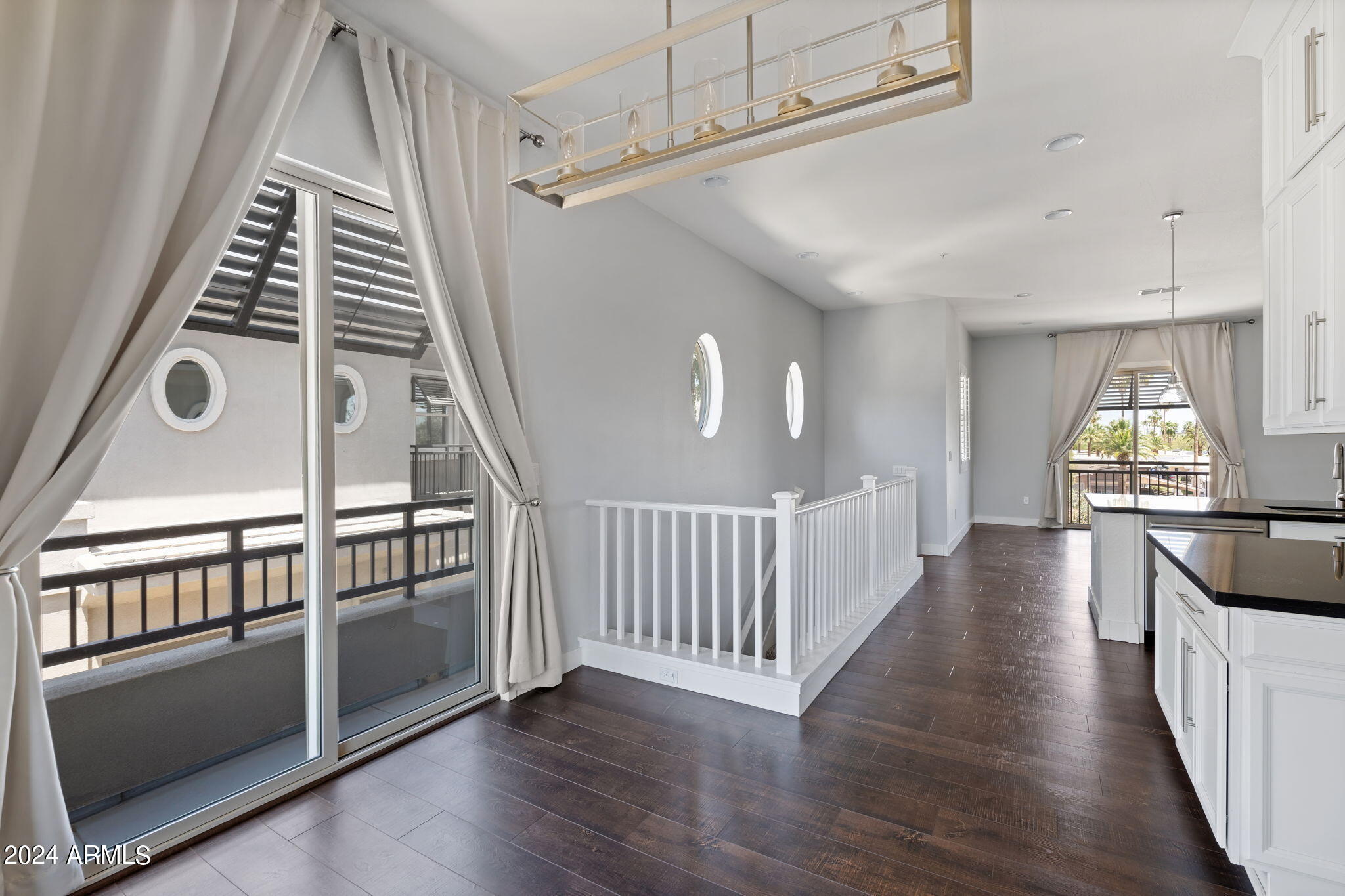 6565 East Thomas Road, Unit 1109 Scottsdale, AZ 85251 - Photo 19 of 40 a view of an entryway with wooden floor