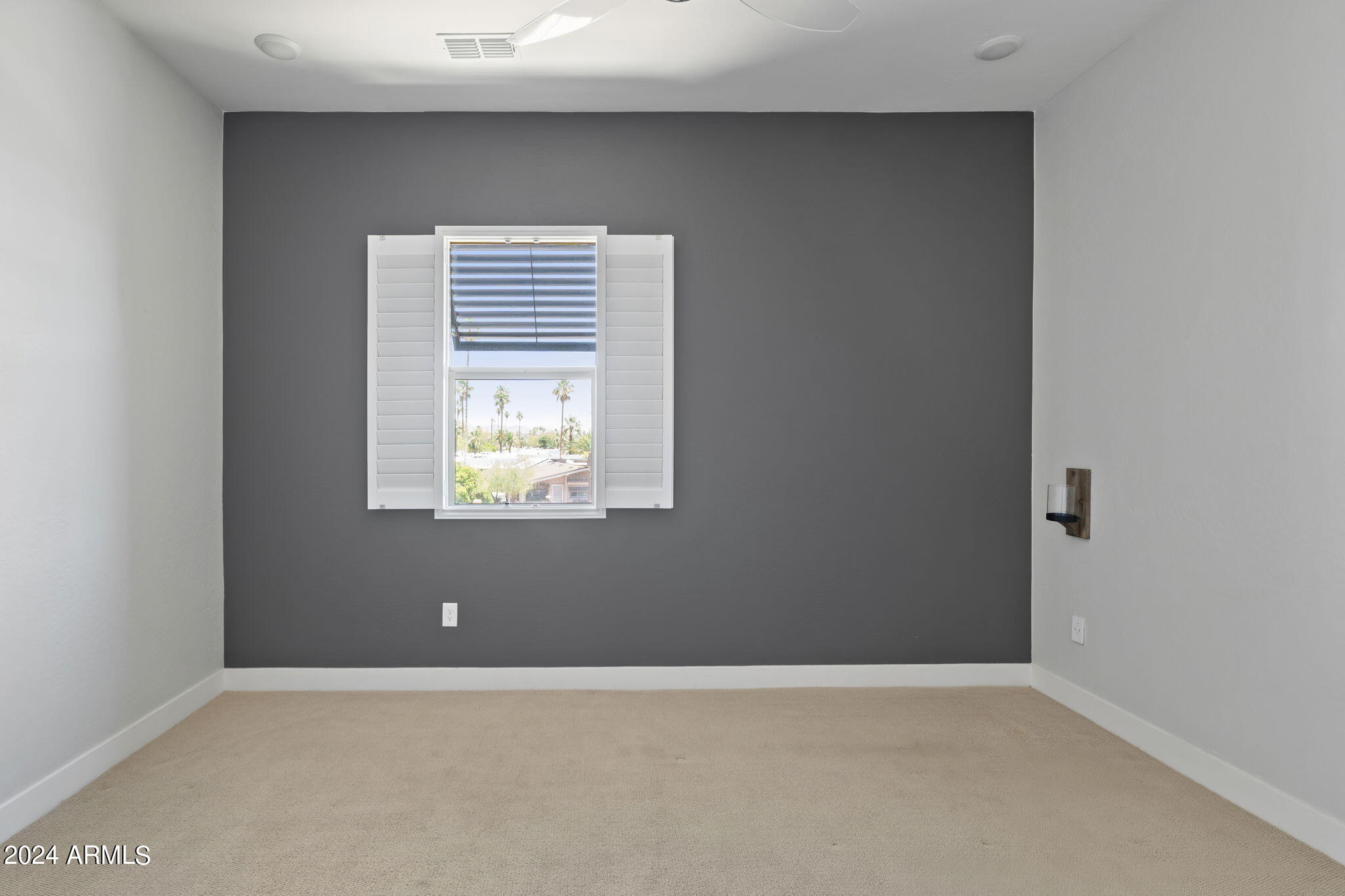 6565 East Thomas Road, Unit 1109 Scottsdale, AZ 85251 - Photo 25 of 40 a view of an empty room with a window