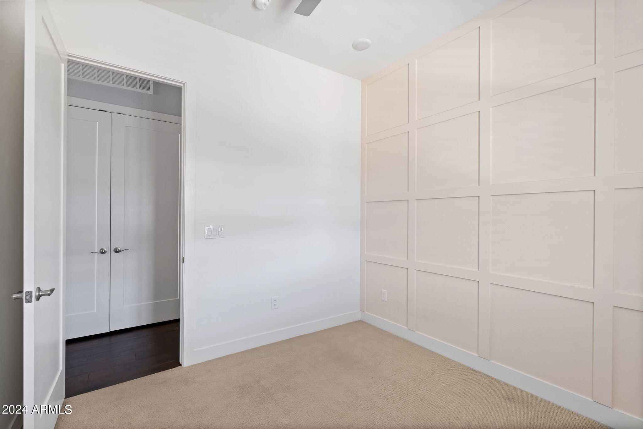 6565 East Thomas Road, Unit 1109 Scottsdale, AZ 85251 - Photo 29 of 40 a view of a closet area with empty racks