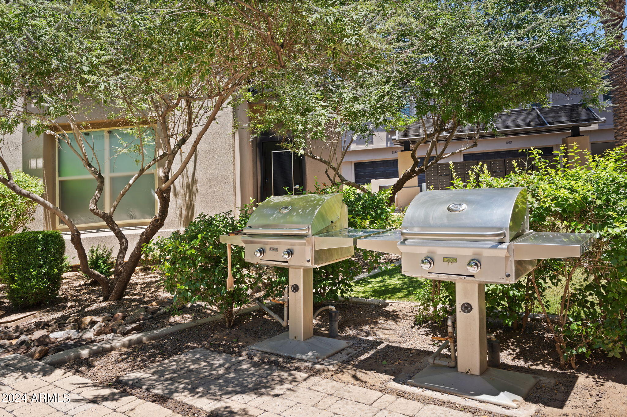 6565 East Thomas Road, Unit 1109 Scottsdale, AZ 85251 - Photo 39 of 40 a view of a yard with plants and large trees