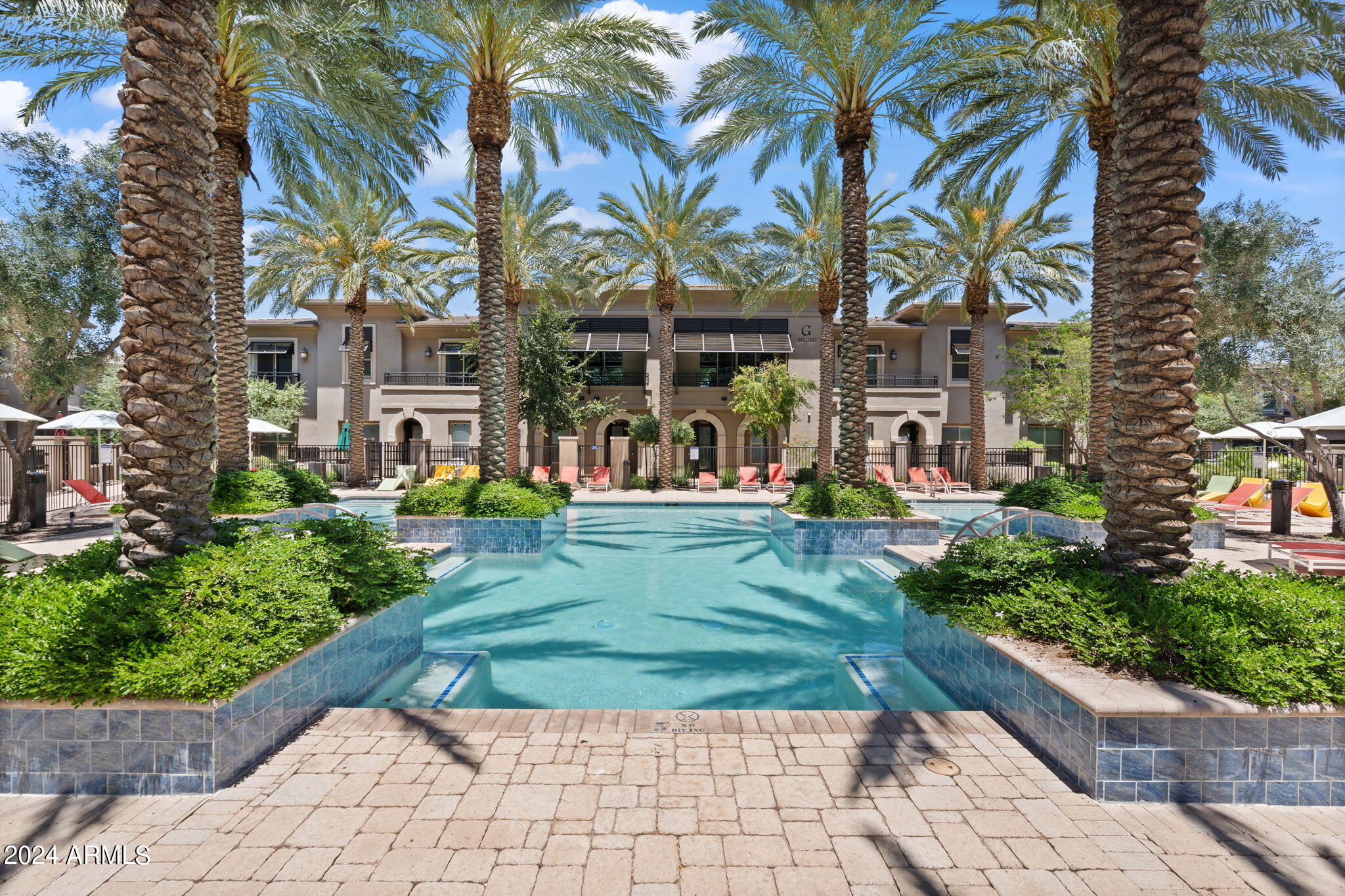 6565 East Thomas Road, Unit 1109 Scottsdale, AZ 85251 - Photo 5 of 40 a view of a park with multi story residential apartment building in the back