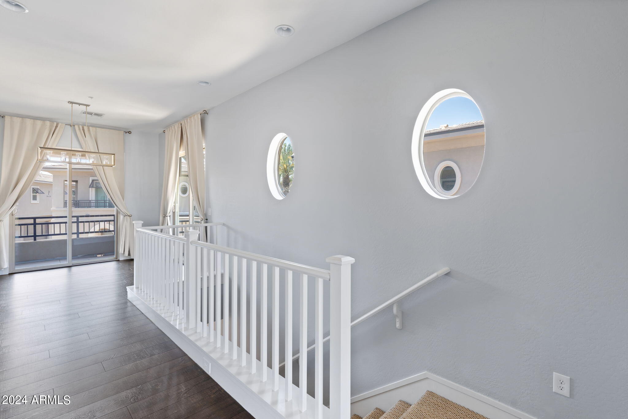 6565 East Thomas Road, Unit 1109 Scottsdale, AZ 85251 - Photo 10 of 40 a view of a livingroom with wooden floor