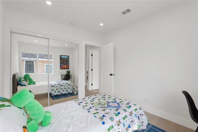 a bedroom with furniture and a bed