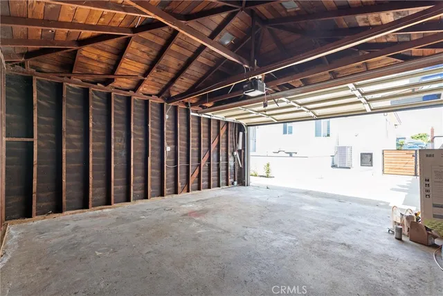 a view of an empty room with windows