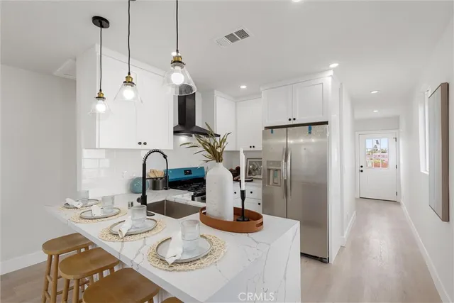 a kitchen with refrigerator and countertop