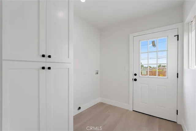 a view of an empty room with closet area