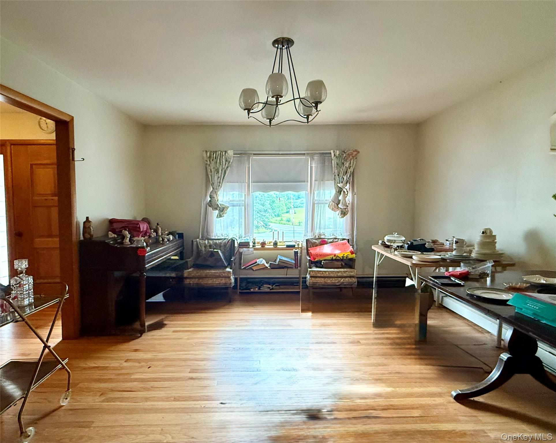 646 Oak Summit Road Millbrook, NY 12545 - Photo 17 of 36 formal dining room currently staging estate sale items