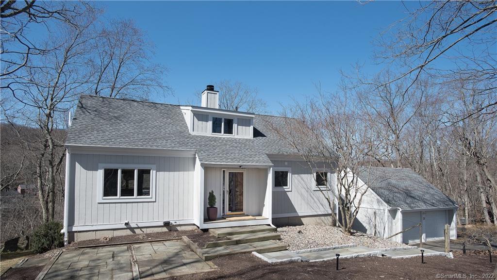 31 Waters Edge Way Ridgefield, CT 06877 - Photo 1 of 1 a front view of a house with a yard