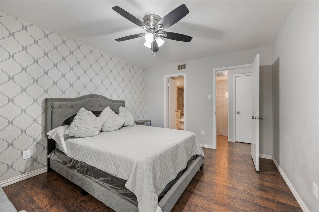 11311 Audelia Road, Unit 265 Dallas, TX 75243 - Photo 12 of 17 a bedroom with a bed and a ceiling fan