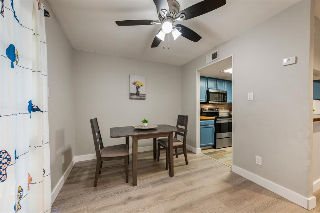11311 Audelia Road, Unit 265 Dallas, TX 75243 - Photo 7 of 17 a view of a workspace with furniture and a kitchen