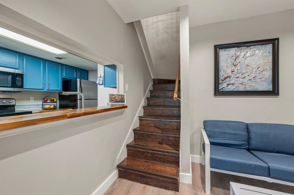 11311 Audelia Road, Unit 265 Dallas, TX 75243 - Photo 10 of 17 a kitchen with stainless steel appliances granite countertop a refrigerator and a stove top oven