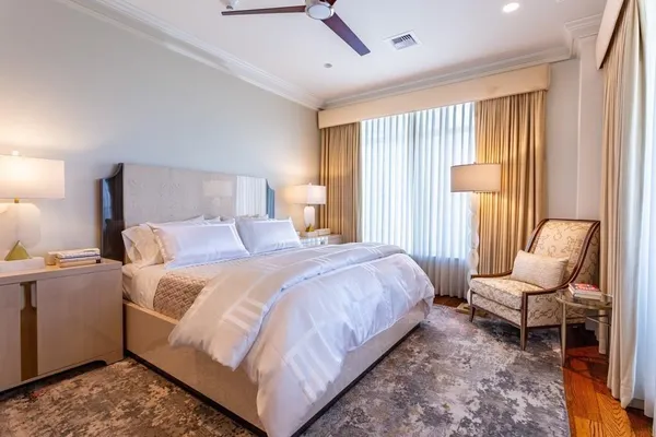 a bedroom with a bed and a couch