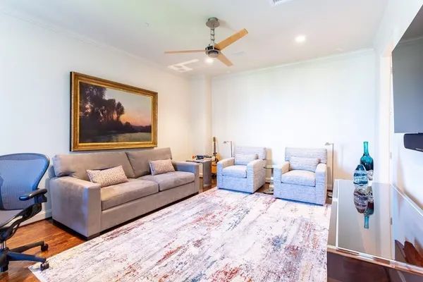 a living room with furniture and a rug