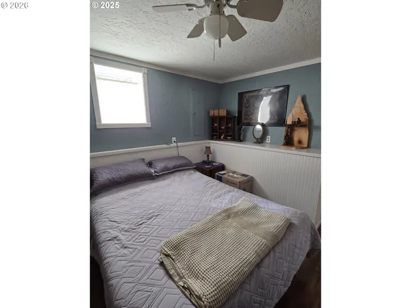 a bathroom with a sink a toilet a shower and a mirror