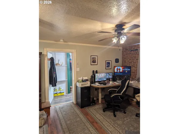 a room with furniture and paintings on the wall