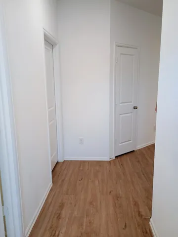 a view of small space with wooden floor