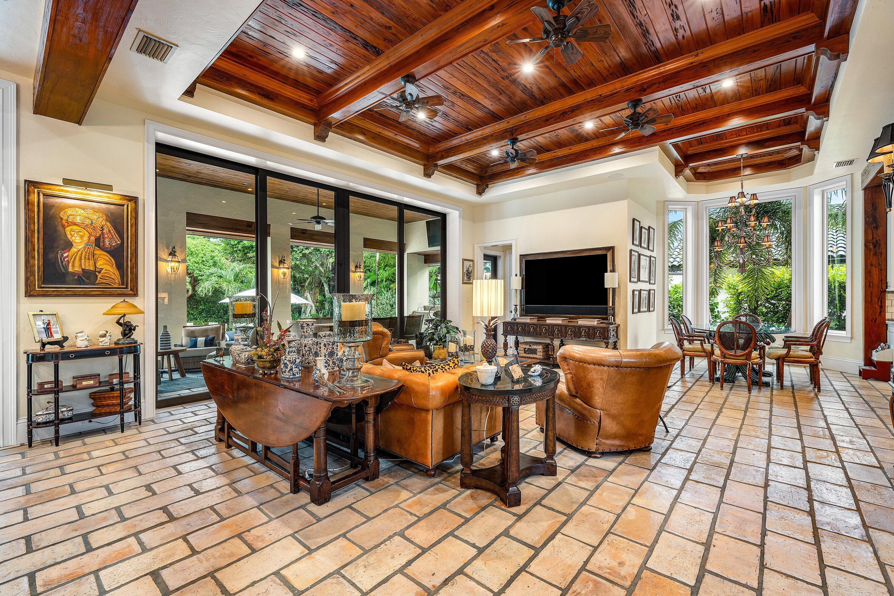 518 Harbor Court Delray Beach, FL 33483 - Photo 13 of 83 a living room with patio furniture and a flat screen tv