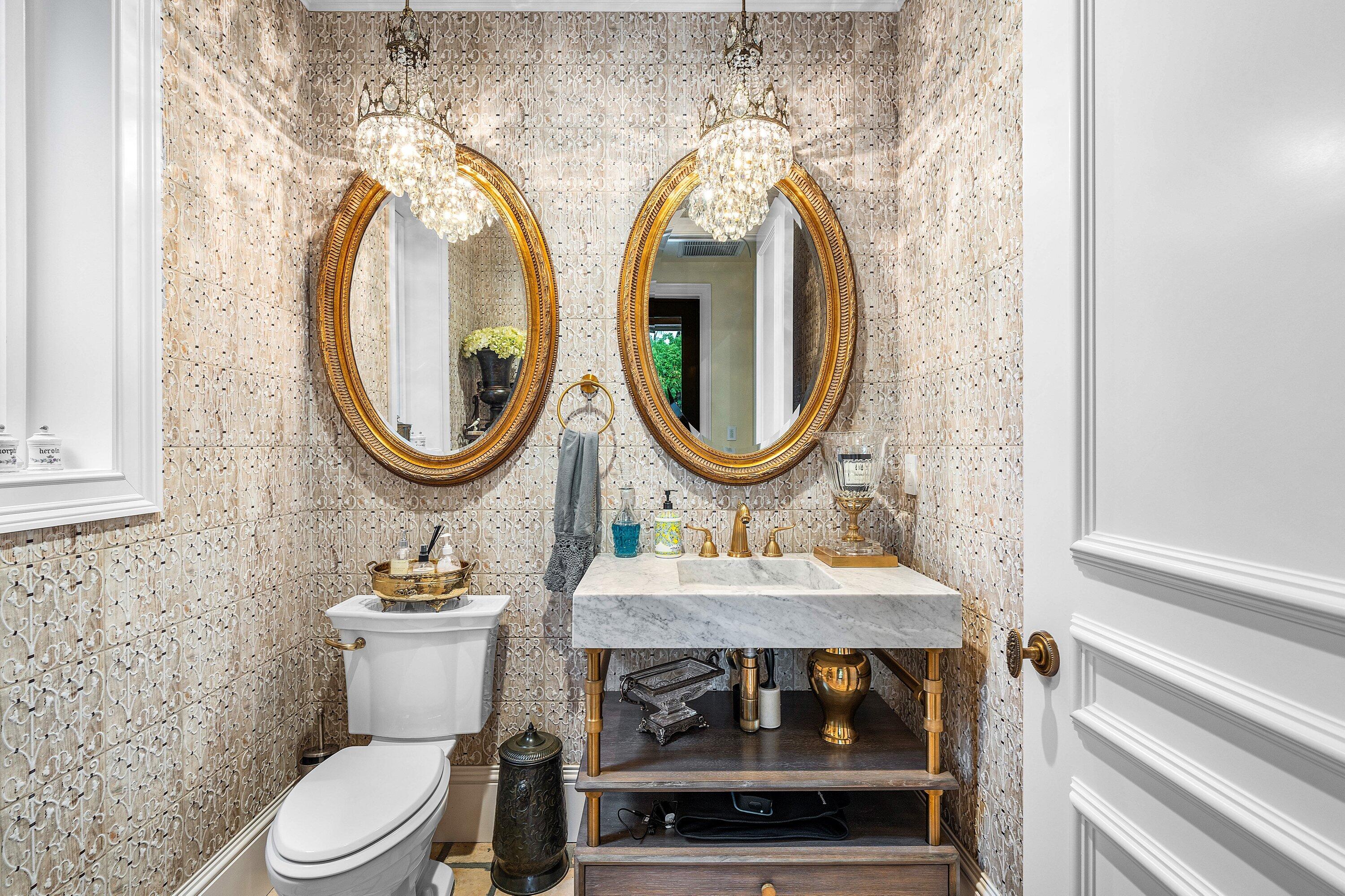 518 Harbor Court Delray Beach, FL 33483 - Photo 16 of 83 a bathroom with a toilet a sink and a mirror