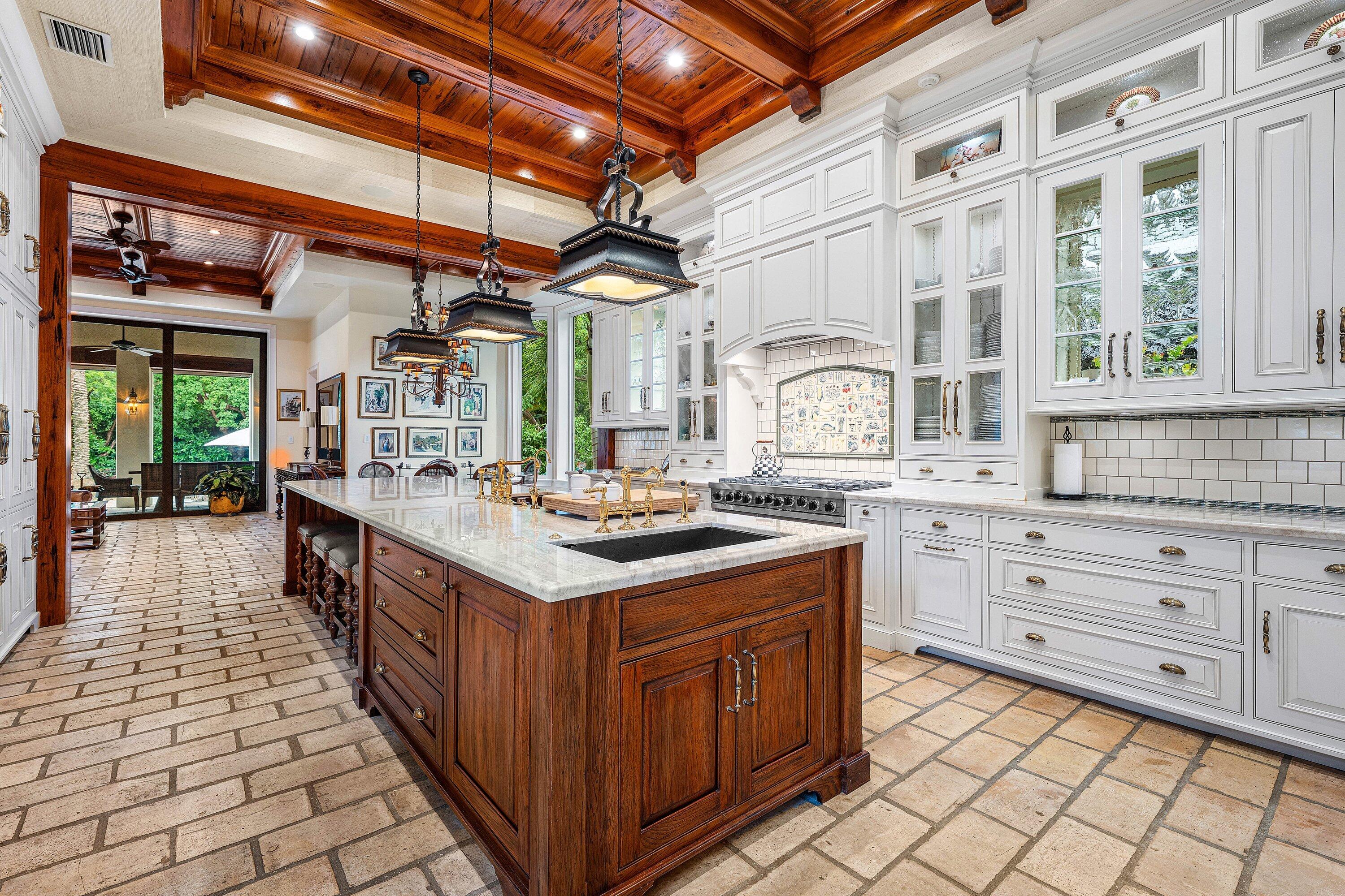 518 Harbor Court Delray Beach, FL 33483 - Photo 19 of 83 a kitchen with stainless steel appliances granite countertop a stove and a sink