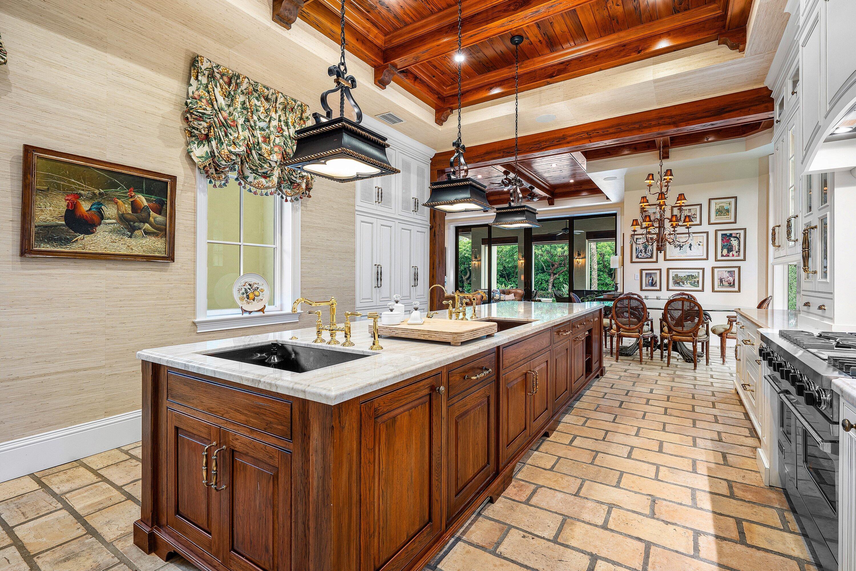 518 Harbor Court Delray Beach, FL 33483 - Photo 20 of 83 a kitchen with stainless steel appliances granite countertop a stove a sink and a microwave