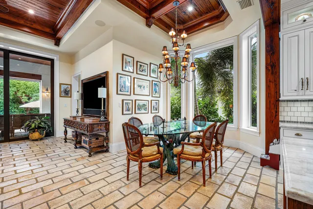 a spacious bedroom with a large bed and a large window