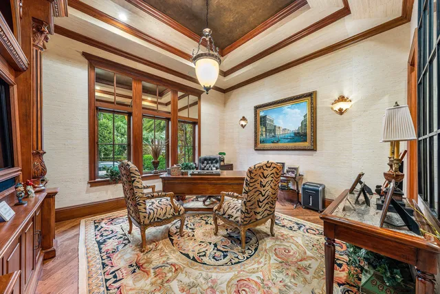 a bathroom with a granite countertop double vanity sink mirror bathtub and window