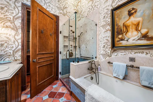 a bathroom with a double vanity sink mirror and shower