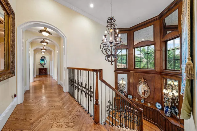 a bathroom with double vanity sinks a toilet a mirror and shower