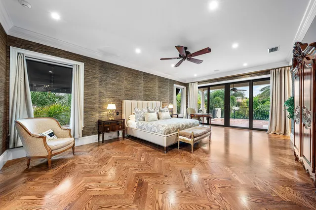 a living room with furniture and a balcony