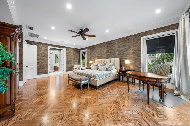 a room with furniture pool table and windows