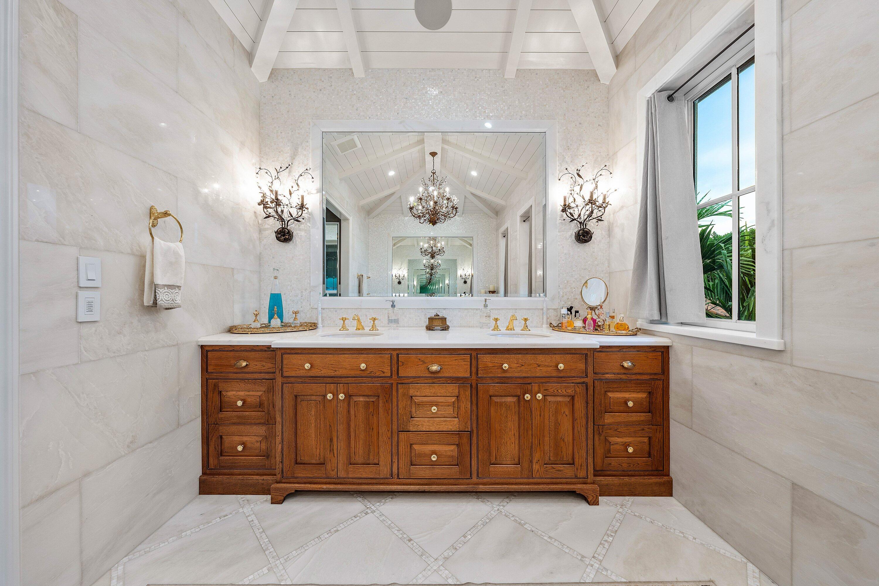 518 Harbor Court Delray Beach, FL 33483 - Photo 39 of 83 a bathroom with a granite countertop double vanity sink mirror bathtub and window