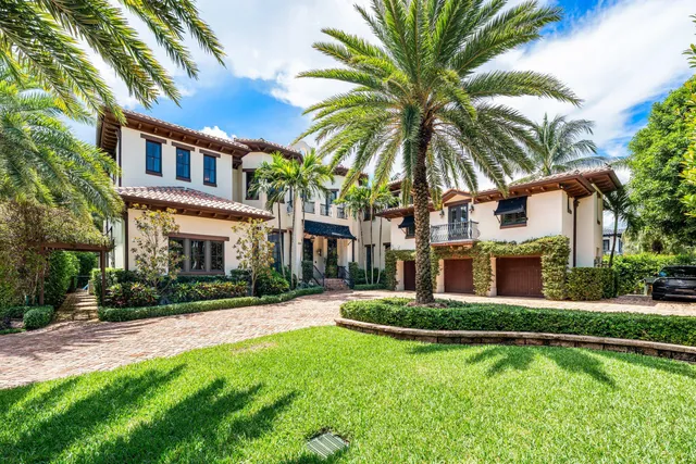 a front view of house and yard with green space