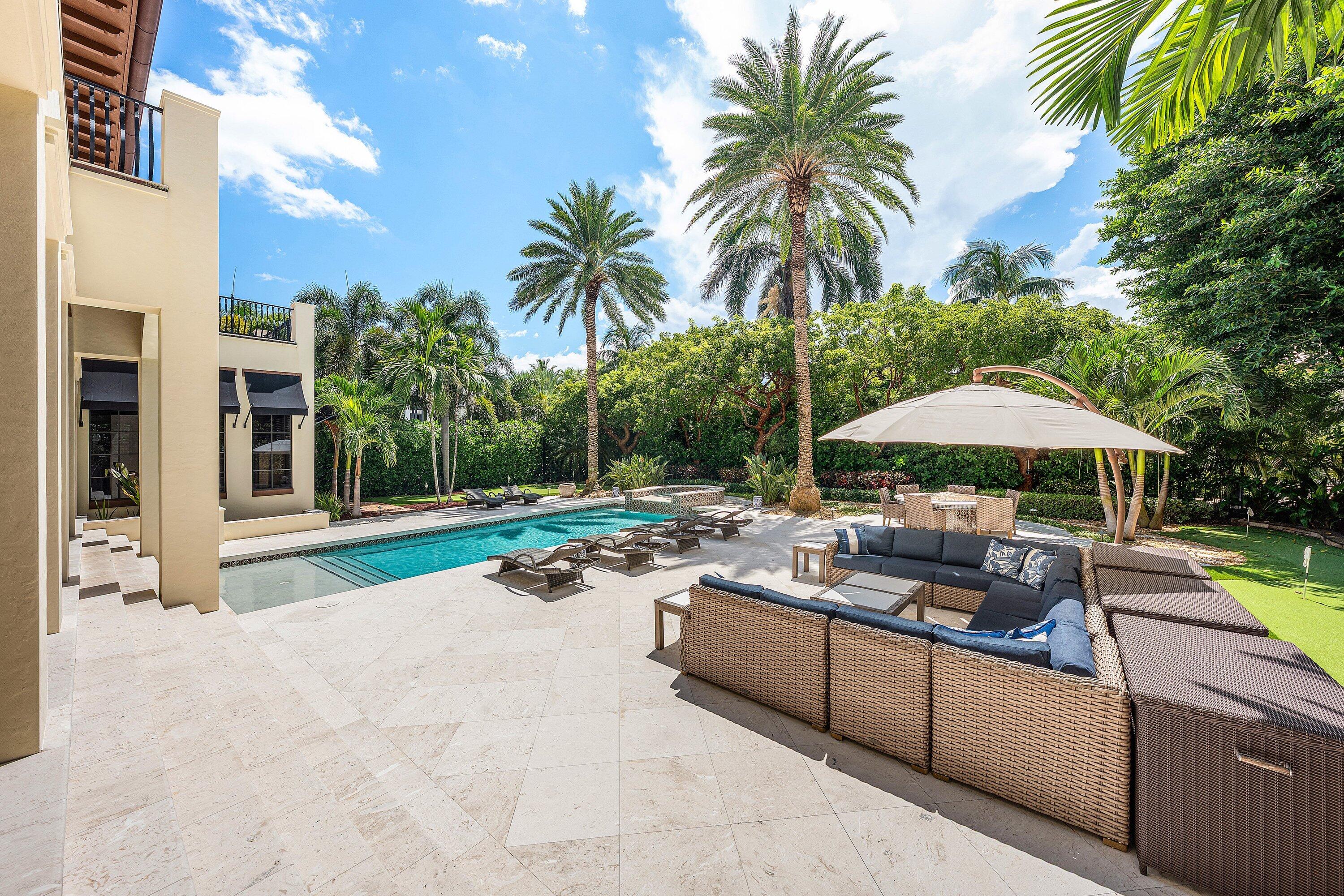 518 Harbor Court Delray Beach, FL 33483 - Photo 62 of 83 a view of a backyard with a sitting area and furniture