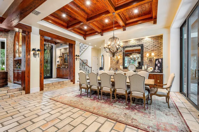 a living room with patio furniture and a flat screen tv