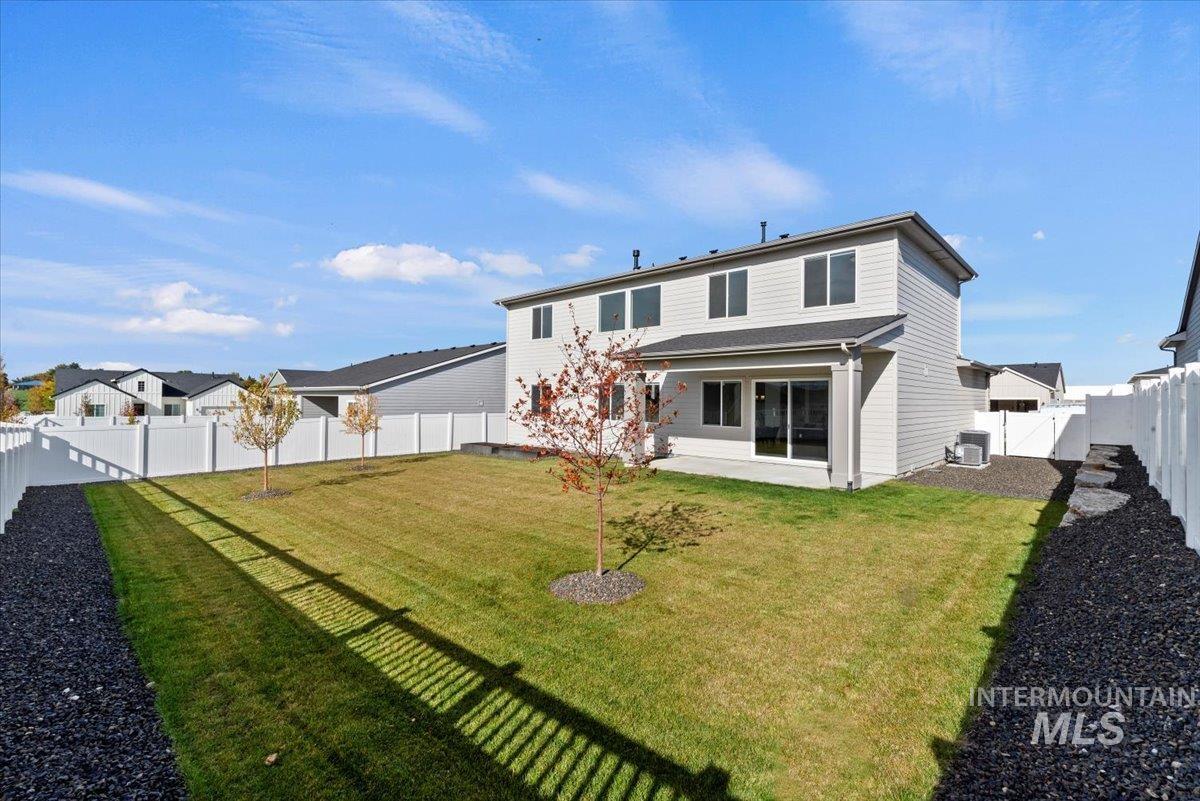 14701 Port Royal Street Caldwell, ID 83607 - Photo 33 of 40 Rear view of property with a fenced backyard, a patio, a residential view, and a gate