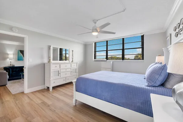 a bedroom with a large bed and a couch