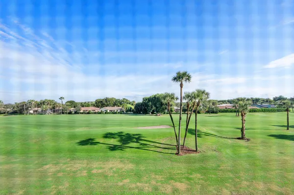 a view of a golf course with a lake view