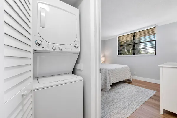 a view of utility room and bedroom