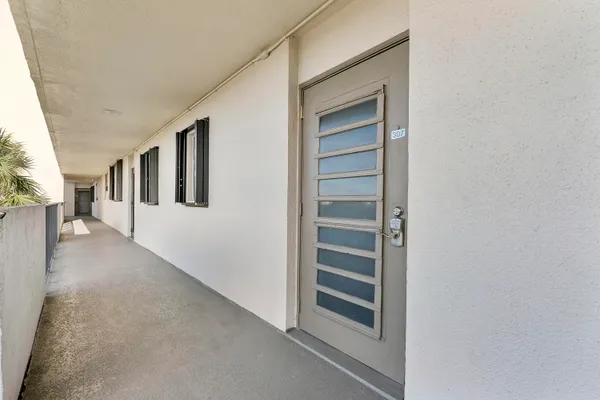 a view of a hallway with stairs